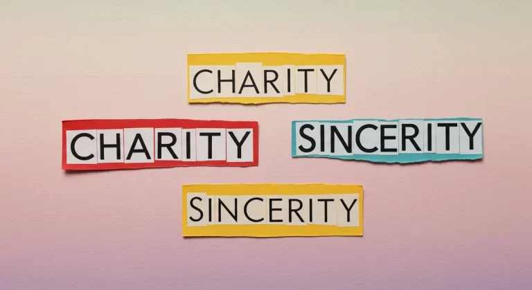 What does charity and sincerity mean? The image shows the words "CHARITY" and "SINCERITY" in colorful paper cut-outs, symbolizing the essence of what charity and sincerity mean.