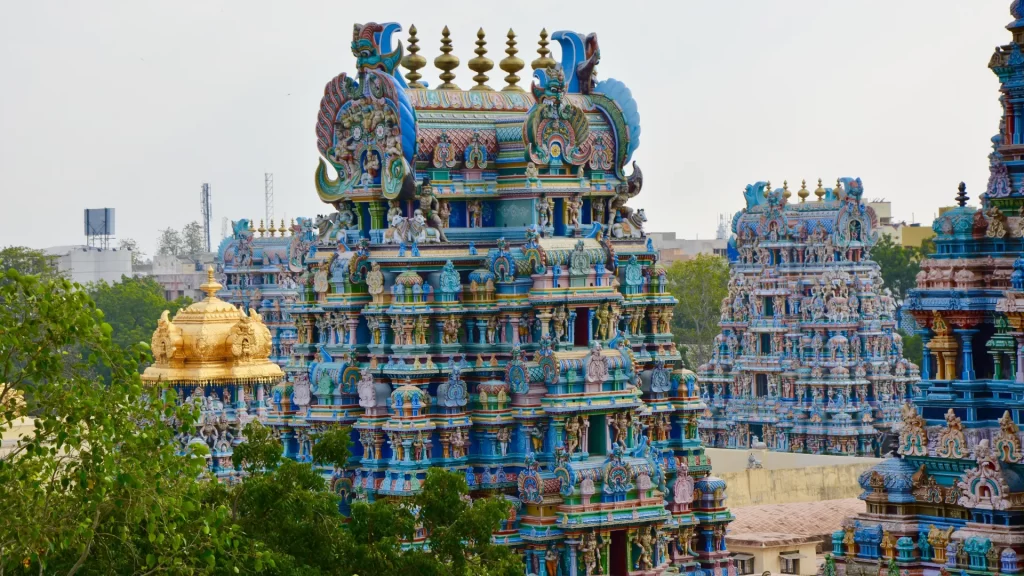 Close-up of Madurai Meenakshi Temple's beautifully detailed towers, a must-visit on the Madurai Tanjore travel package.