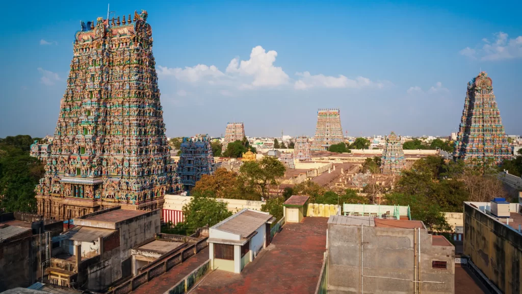 Madurai Meenakshi Temple towers view, part of the Madurai Tanjore travel package, with vibrant architecture.